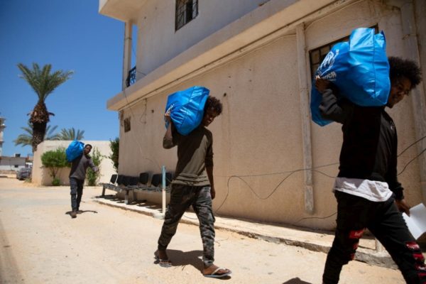 Some of the 200 asylum-seekers released from Zawiya Al Nasr detention centre in Libya are received at UNHCR’s office in Sarraj, Tripoli, where they are given food baskets, hygiene kits and medical checks