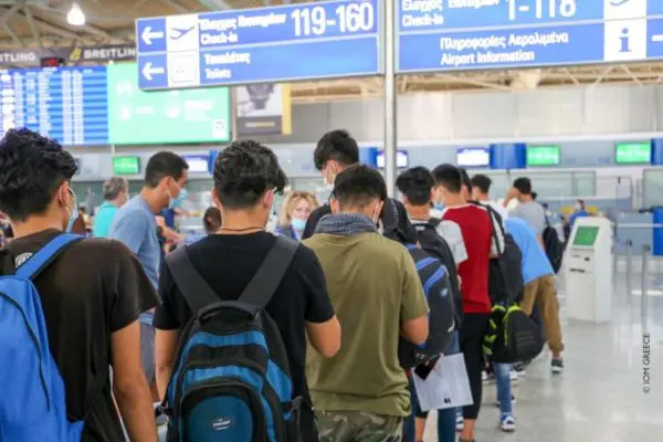 A group of unaccompanied children prepare to check in for their flight from Athens to Lisbon on 7 July, under an EU relocation scheme.