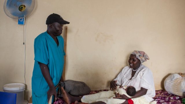 Dr. Evan Atar talks to Sudanese patient Gisma Al Amin, in the maternity ward.