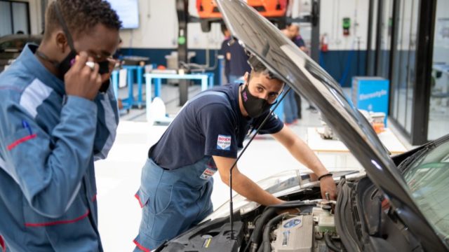Yemeni refugee, Waleed (right), 28, takes part in a hybrid mechanics class as part of his diploma at Luminus Technical University College in Amman, Jordan