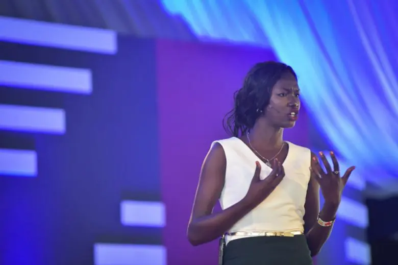 South Sudanese teacher and student, Mary Nyiriak Maker, speaks on stage at the first ever TEDx event held at a refugee camp in Kakuma, Kenya. 