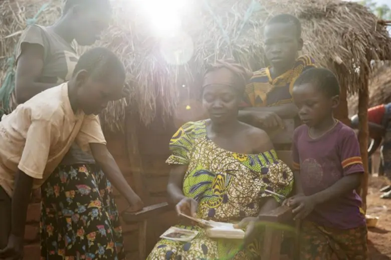 A displaced family sits outside their shelter in the Central African Republic.