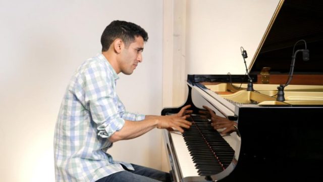 Aeham Ahmad, the “Pianist of Yarmouk,” recording his Nansen performance in Kassel, Germany.