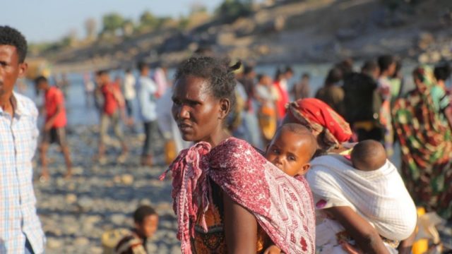 Ethiopian refugees fleeing clashes in the Tigray region, cross the border into Hamdayet, Sudan.