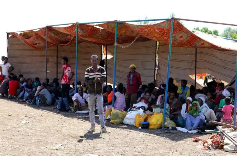Ethiopians, who fled their homes due to ongoing fighting, are pictured at a refugee camp.