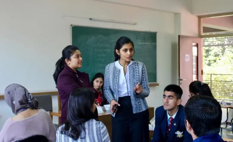 Students in New Delhi, India, exchange ideas to address climate displacement.