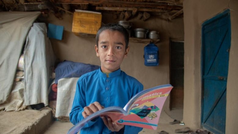  A young Afghan refugee in Pakistan does his homework. 