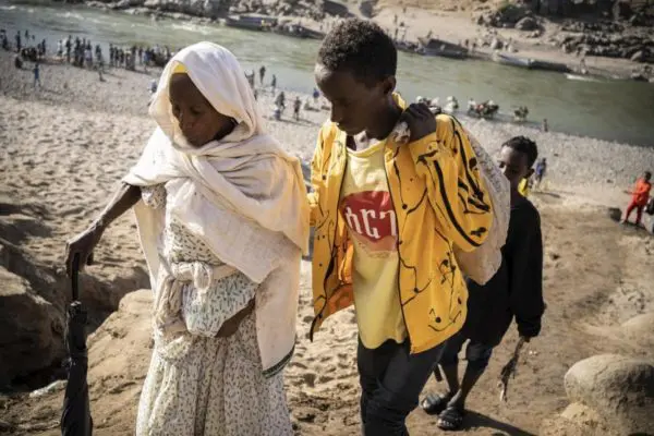 Elderly woman and younger boy are both fleeing clashes in Tigray region.