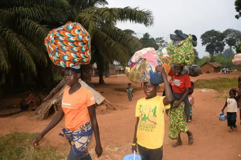 Families arrive in Ndu village in the Democratic Republic of the Congo after fleeing Bangassou town in the Central African Republic.
