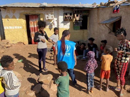 A UNHCR officer talks to refugees in Mai Aini refugee camp. The biggest concerns of the refugees are food, clean water, and the security situation in the camps. The refugees report almost nightly looting by armed gangs