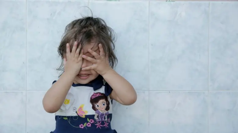 A young girl who fled with her mum to escape violence in Central America after arriving in Tapachula, Mexico