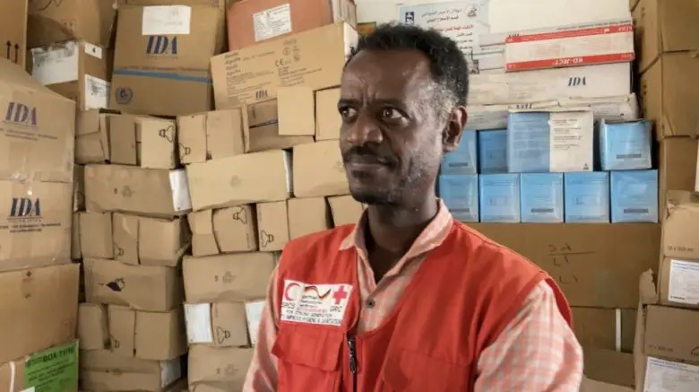 Man poses inside a health clinic.