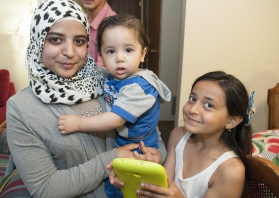A refugee family from Syria pictured at their home.