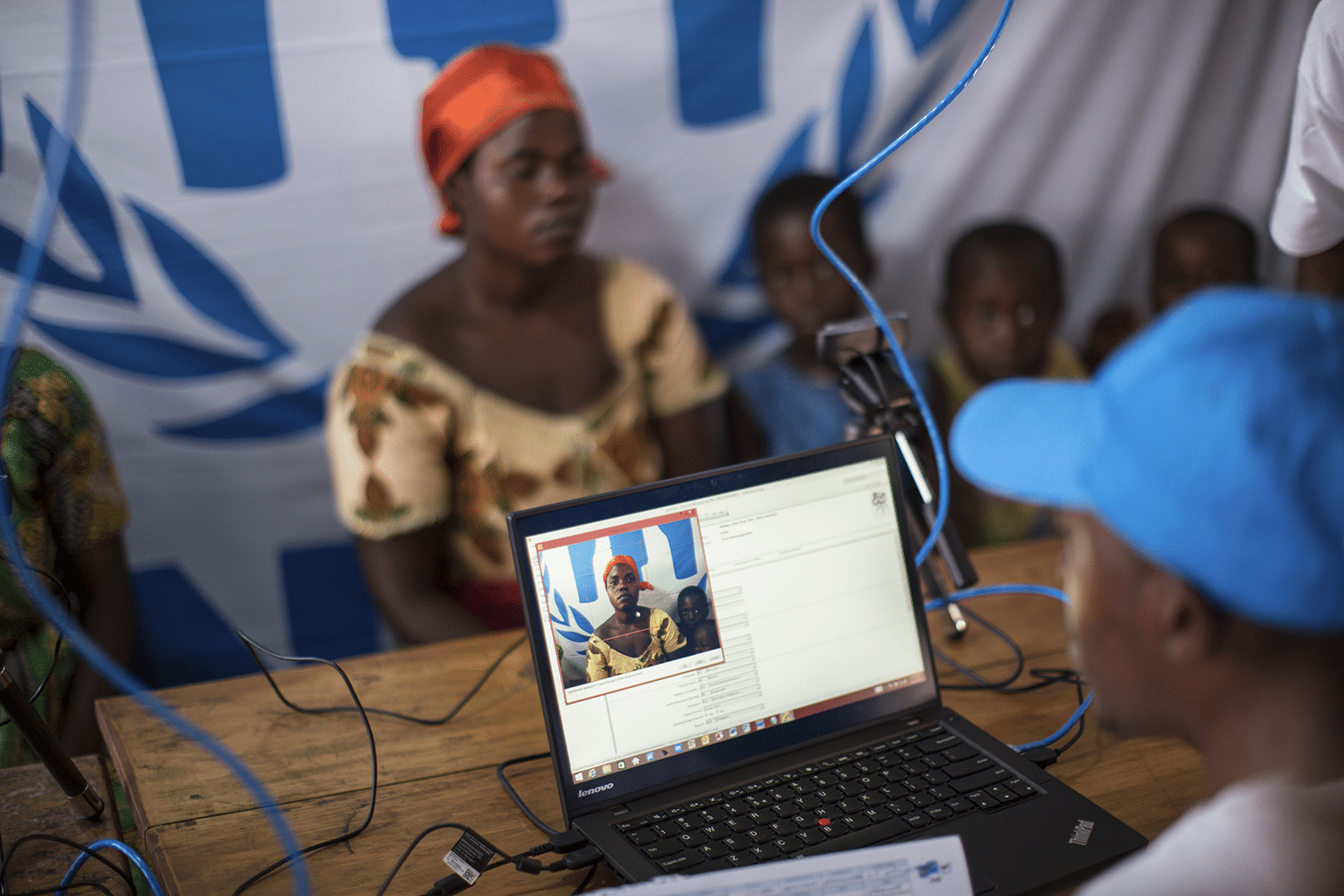 Refugee Aline poses for her photo during UNHCR