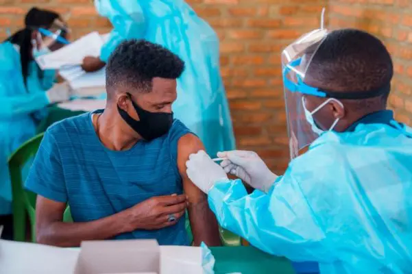 Man receives a vaccine.