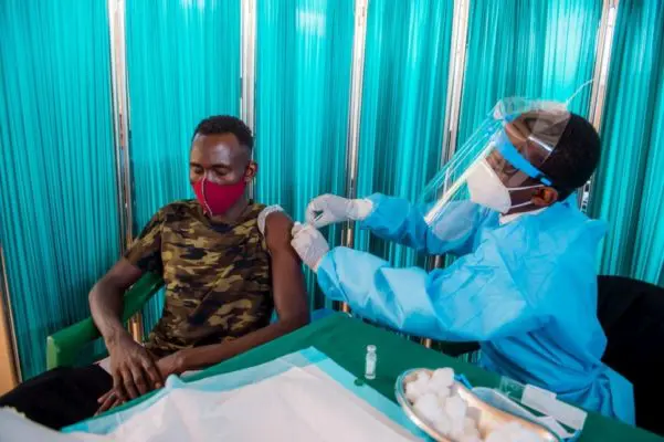 Man receives a vaccine.