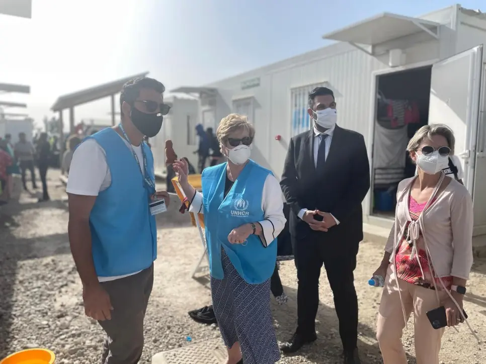 UNHCR’s Assistant High Commissioner for Protection, Gillian Triggs (centre), visits the Pournara First Reception Centre.