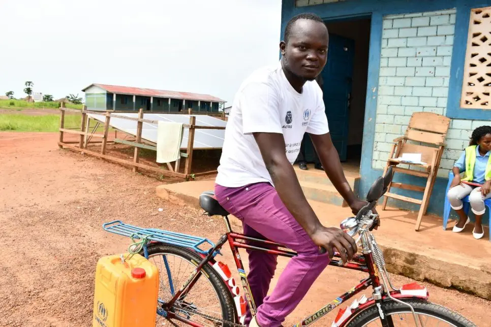 Man rides his bike. 