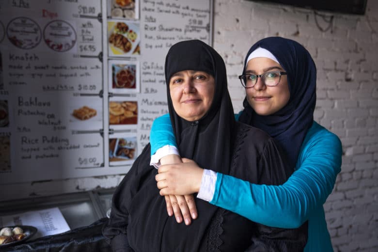 Aya Wadi and her mother Duha in their restaurant in Thunder Bay, Ontario