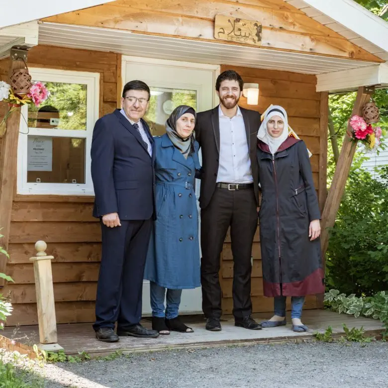 Peace by Chocolate founder and CEO Tareq Hadhad (second from right) stands alongside family members (from left) father Isam, mother Shahnaz, and sister Alaa in Antigonish, Nova Scotia