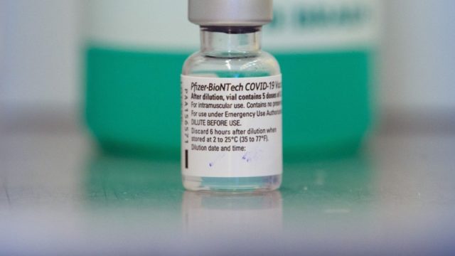 A vial of Pfizer-BioNTech's COVID-19 vaccine is pictured at a vaccination site.