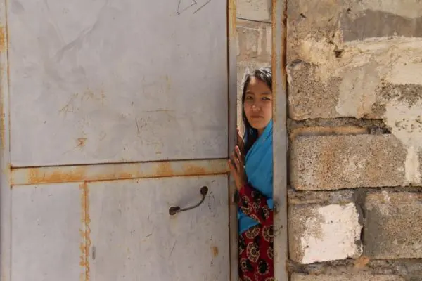 A young Afghan refugee at her home.