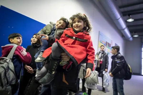 A Syrian father and his children.