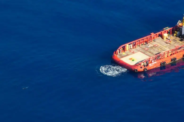 A migrant swims towards the Vos Triton commercial supply ship off the coast of Libya’s coast on May 11, 2019