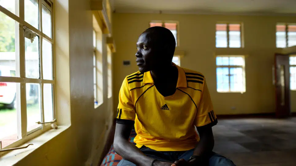 South Sudanese refugee and middle-distance runner Paulo Amotun Lokoro, 29, sits in a room at the training camp near Nairobi, Kenya.