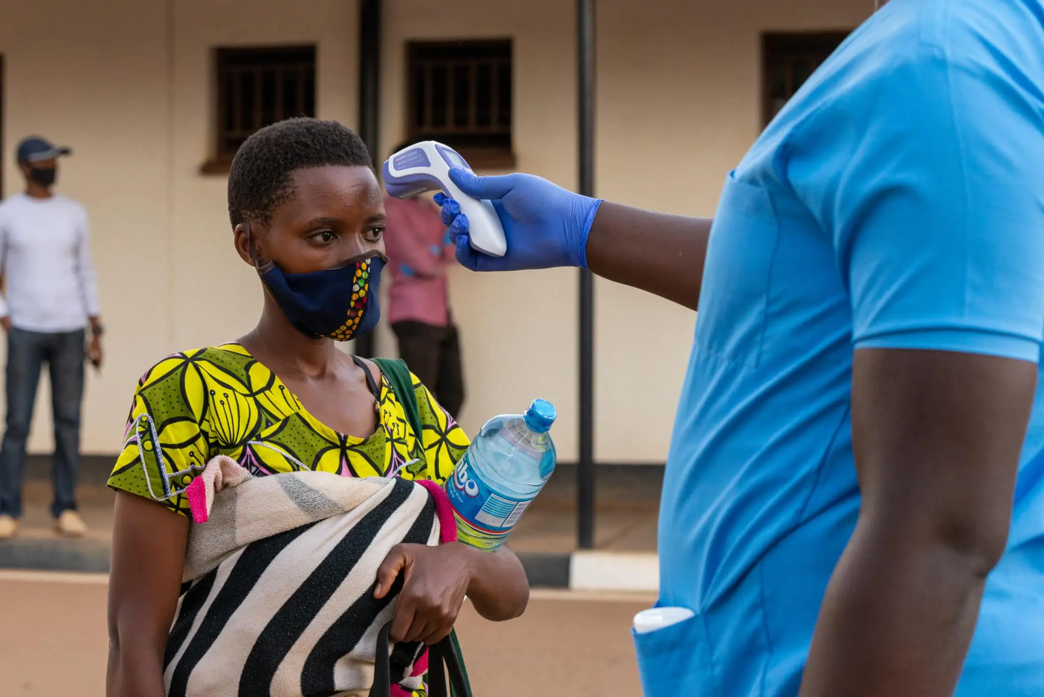 Women getting temperature check in Rwanda 