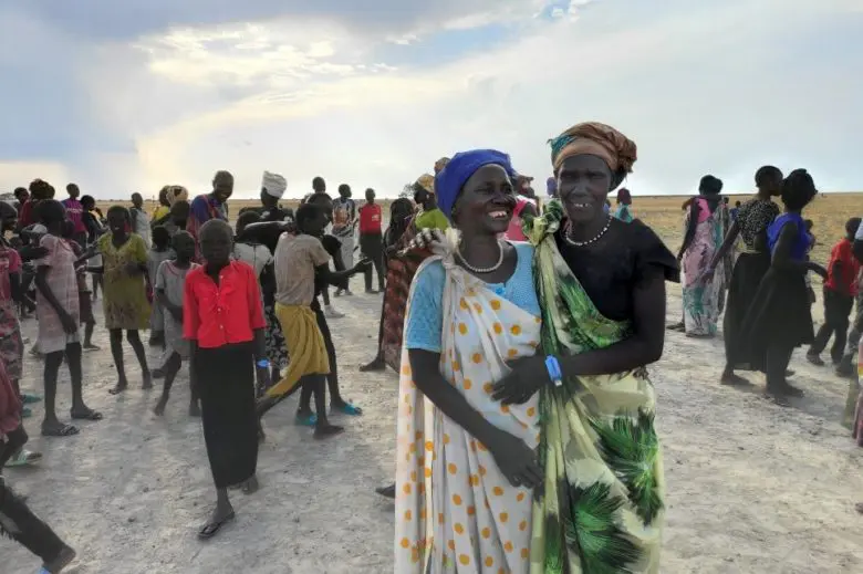 two women smiling infront of camera