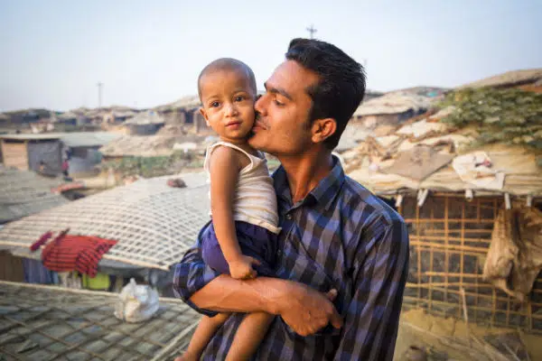 A Rohingya man with his child