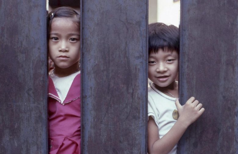 Two children looking at camera