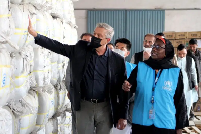 UN High Commissioner for Refugees Filippo Grandi inspects emergency relief items at a warehouse in Kabul, Afghanistan