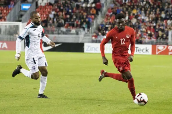 Alphonso Davies playing soccer