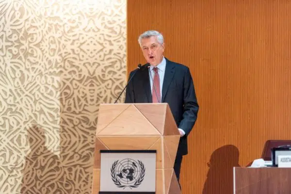 man standing in front of podium