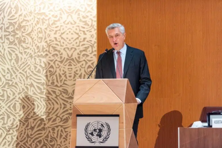 man standing in front of podium