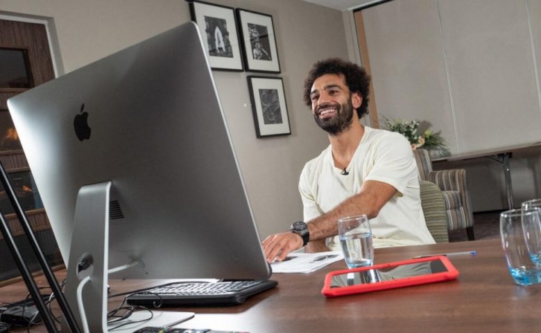 man smiling at computer 