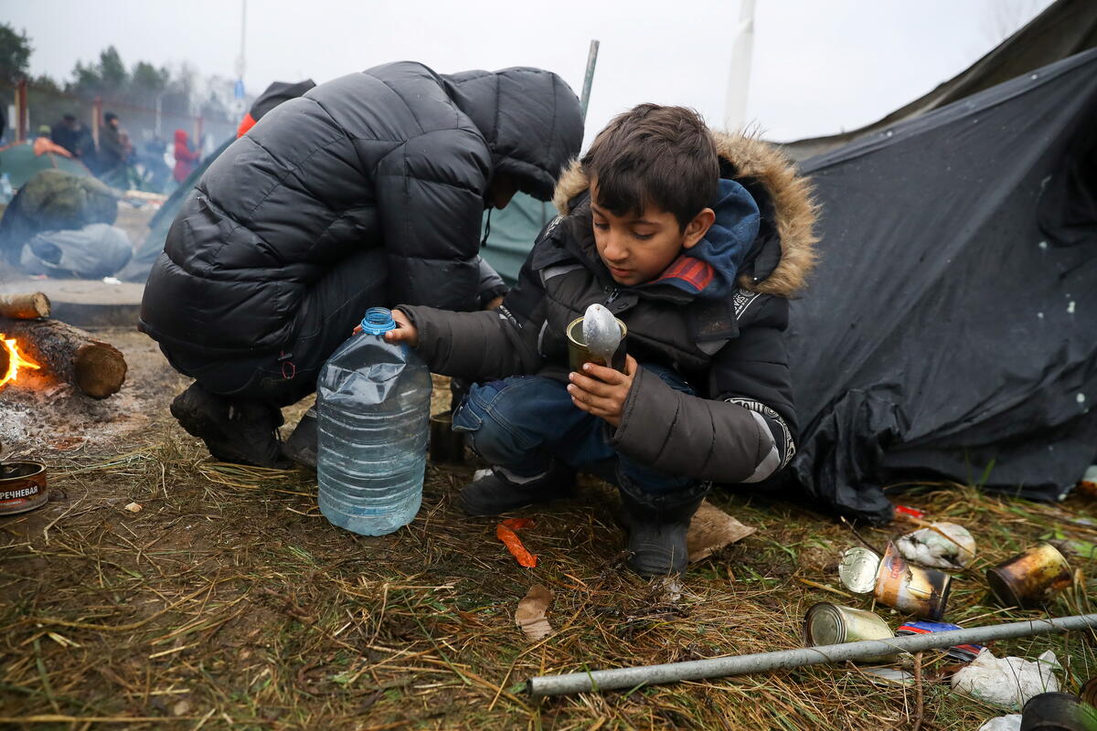 A child at a makeshift camp established by refugees and migrants near the Bruzgi-Kuznica checkpoint on the Belarusian-Polish border on 18 November
