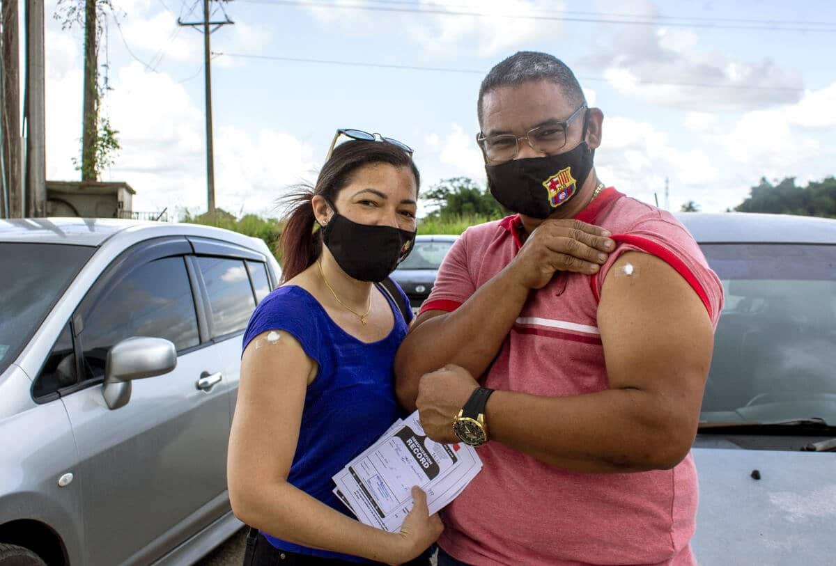 Carlos and Rosiris, a Venezuelan couple living in Trinidad and Tobago, seen after their COVID-19 vaccination on 1 August
