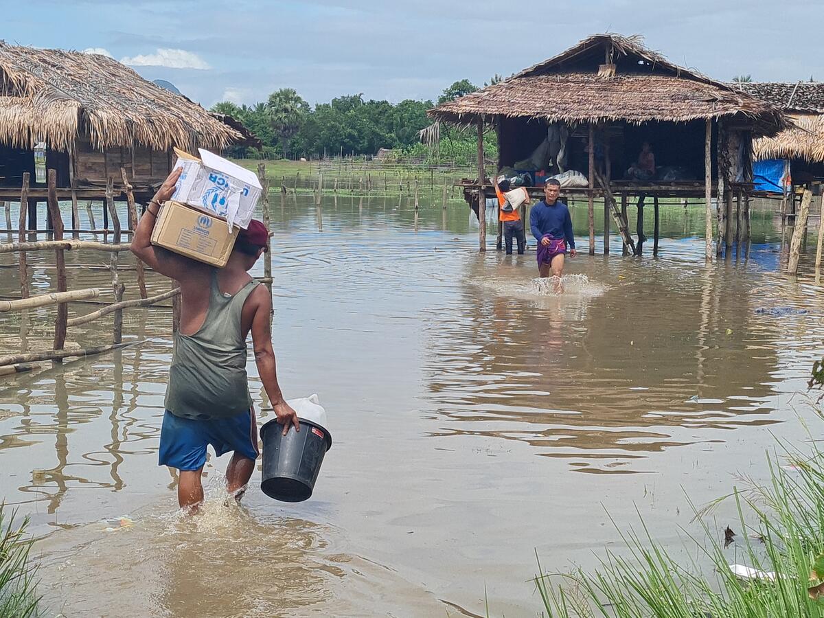 Relief items are delivered to internally displaced people at a flood-prone camp in Myanmar’s Kayin State