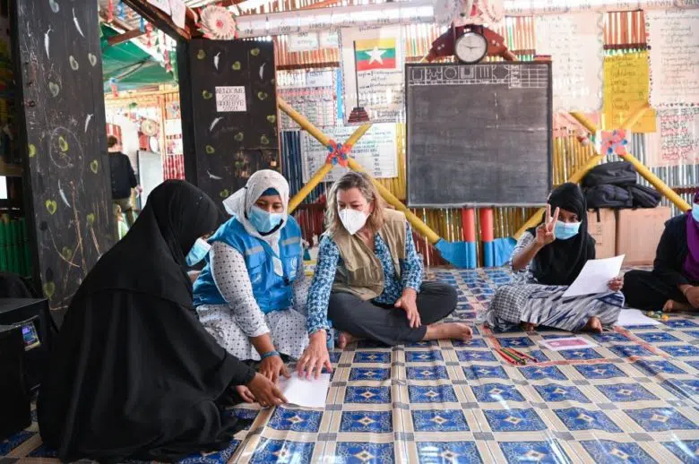 four women sitting on the floor together