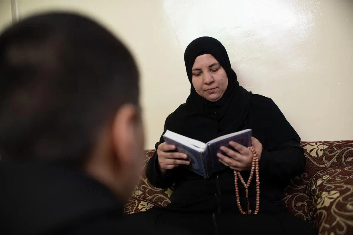 Woman reading the Quran