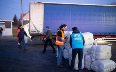 Blanket delivery offers some warmth for refugees waiting to cross Ukraine border