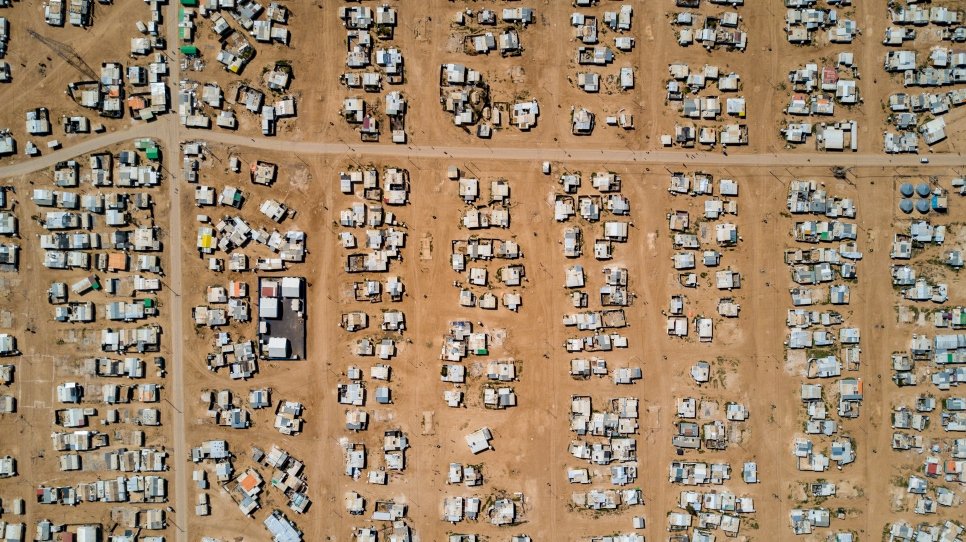 Aerial view of shelters in a camp in the desert