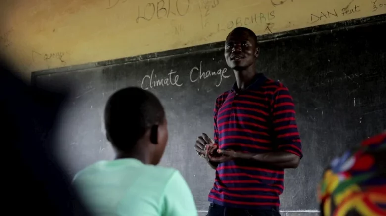South Sudanese refugee and climate activist Opira Bosco Okot teaches a class on climate change at Paluda Secondary School in Uganda’s Palabek Refugee Settlement. © UNHCR/Francis Mukasa