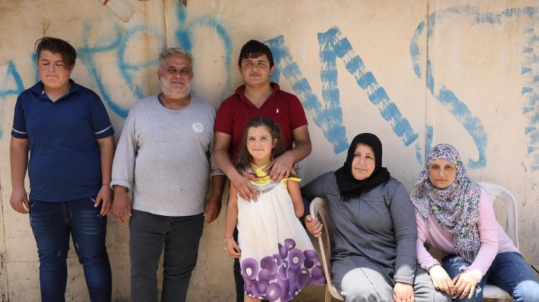 Sarah pictured with her parents and older siblings. © UNHCR/Houssam Hariri