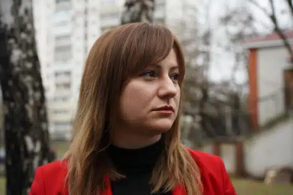 A close-up of a woman staring off to the right