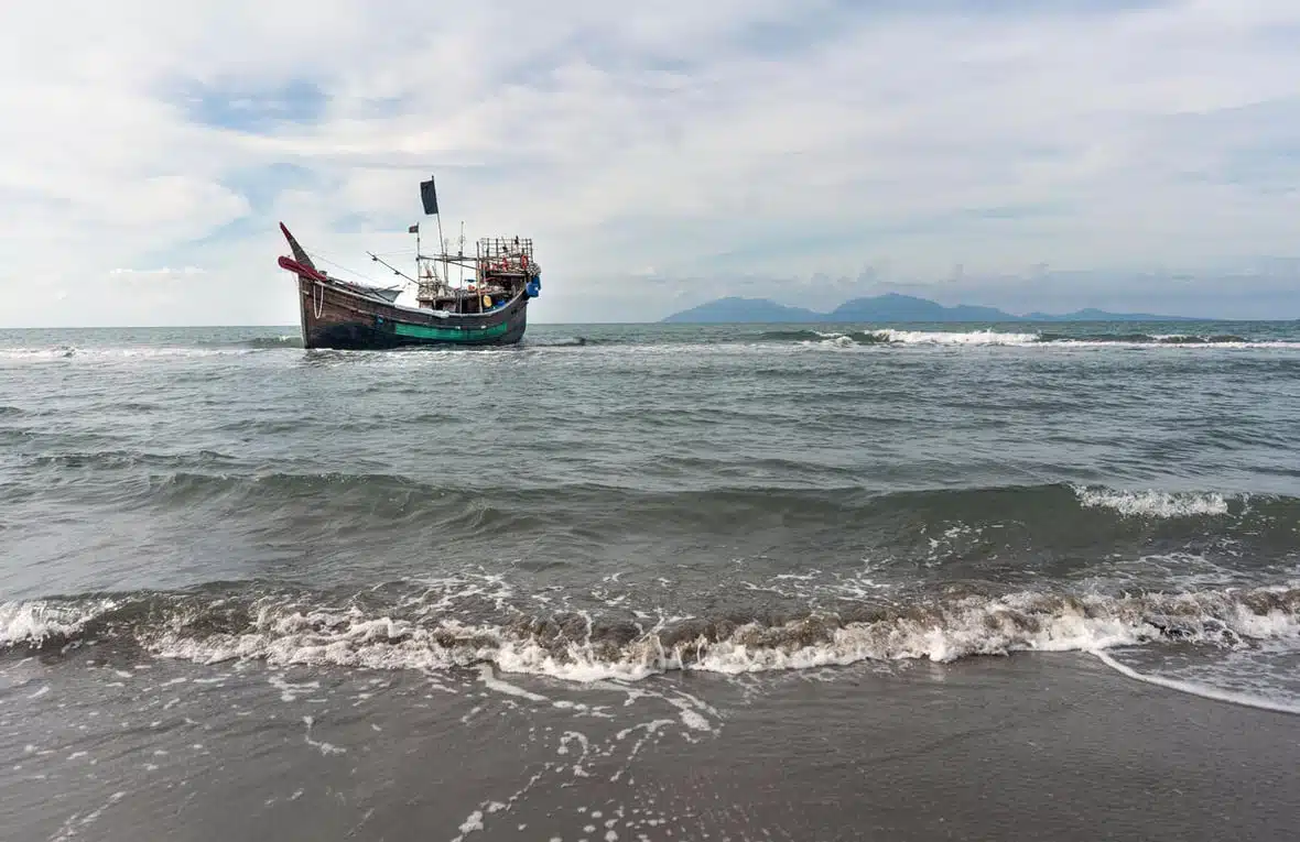 A traditional dinghy boat is seen anchored not far from the shores of Aceh, Indonesia.