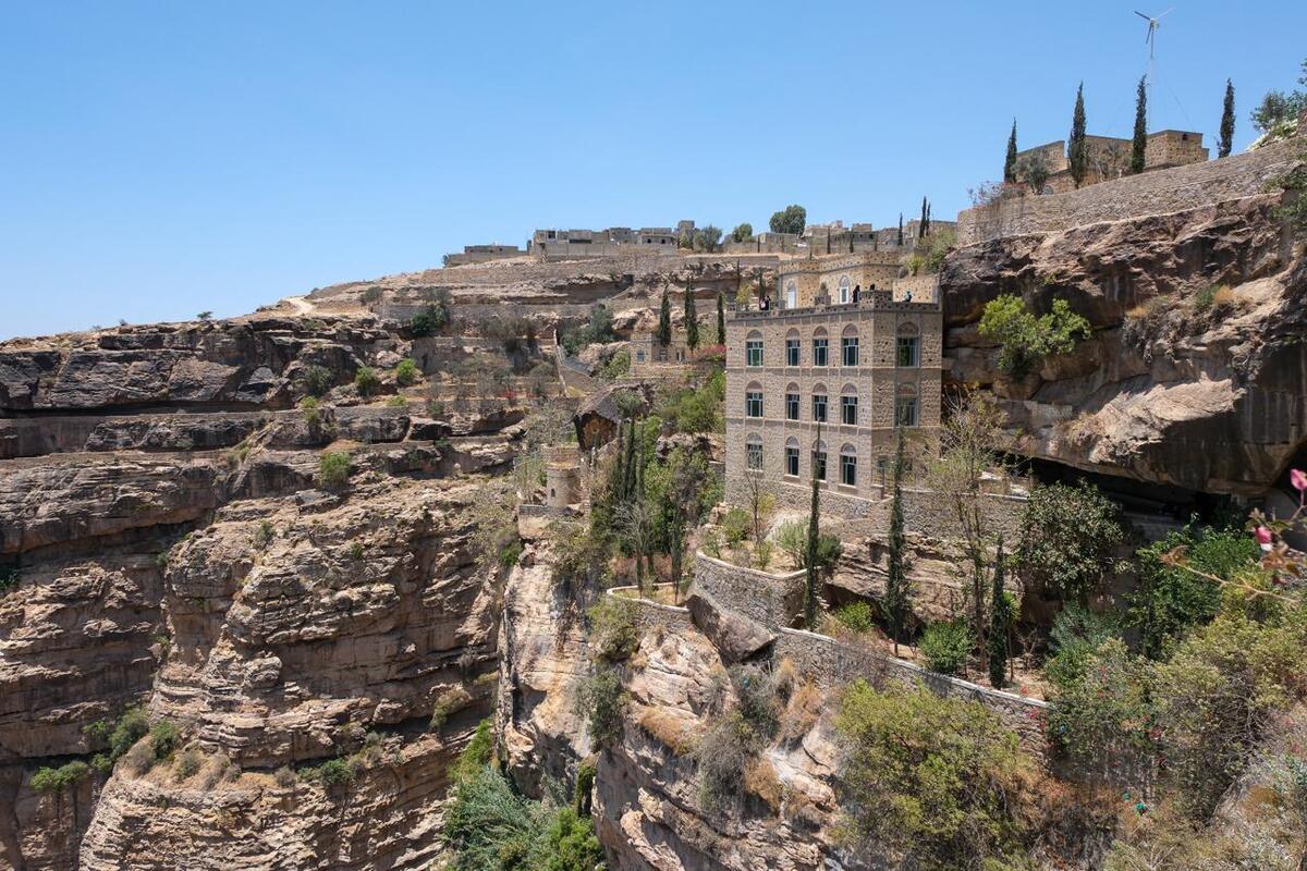 A rocky cliff forms part of the dramatic landscape of Taiz.